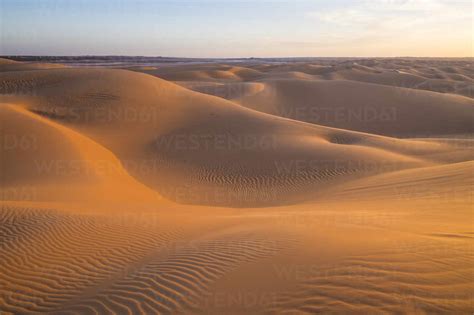 Sunset in the giant sand dunes of the Sahara Desert, Timimoun, western Algeria, North Africa ...