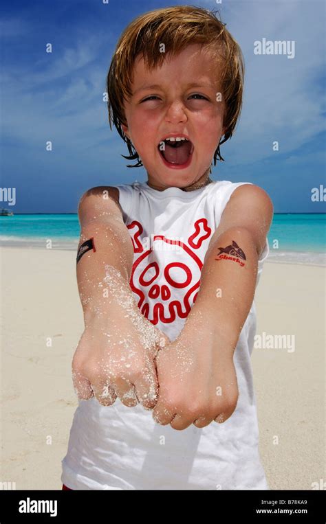 Child on the beach in Laguna Resort, The Maldives, Indian Ocean Stock Photo - Alamy