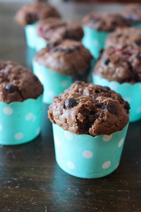 chocolate chip muffins in blue paper cups on a table
