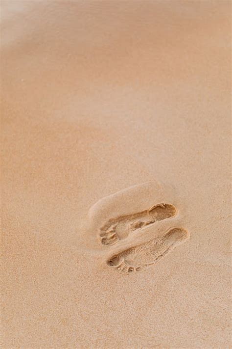 Footprints on Beach Sand · Free Stock Photo