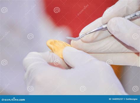 Dental Technician Working in a Lab Stock Image - Image of dental, technician: 144095237