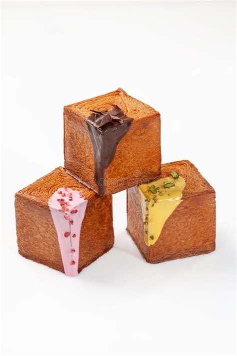 Pyramid of Three Sweet Cubic Croissants with Berry Sauce, Pistachio Cream and Chocolate Glaze ...