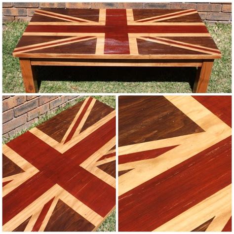 this is a coffee table made out of wood and has an union jack design on it