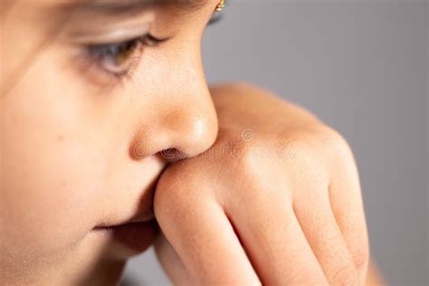 Extreme Close Up of Child Touch`s Her Nose - Concept Showing To Prevent and Avoid Touching Your ...