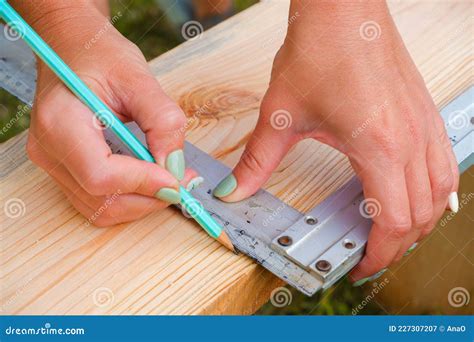 Woman Carpenter Makes Pencil Markings on a Wooden Board. DIY in the Backyard Stock Image - Image ...