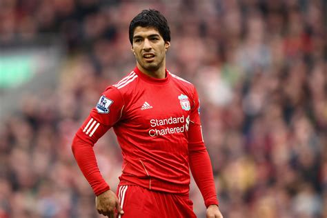 Liverpool former star Luis Suarez is back home in a mansion protected by 14 14-foot security ...