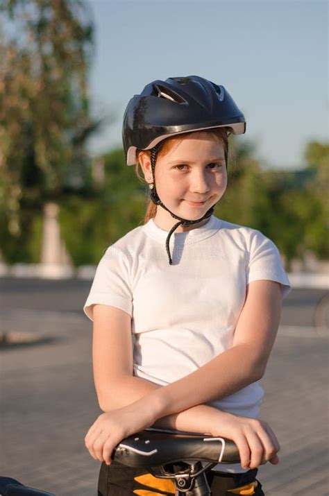 Girl 11 Years Old in the Park with a Bike. Children`s Sports Stock ...