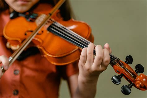 Person Playing Violin in Close Up Photography · Free Stock Photo