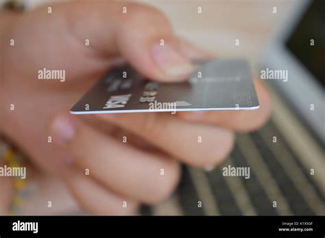 Using a visa debit card for online shopping Stock Photo - Alamy