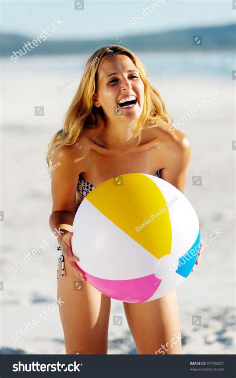 Healthy Young Woman Laughing With Beachball While On The Beach In Summer Stock Photo 97745807 ...