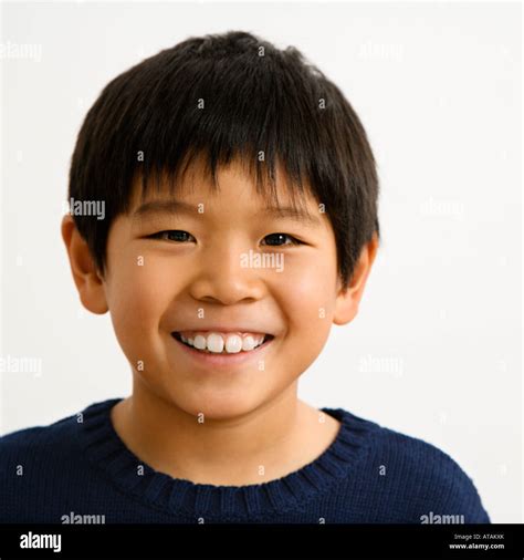 Portrait of young Asian boy smiling Stock Photo - Alamy