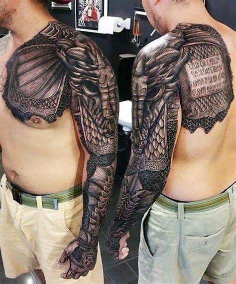 two men with dragon tattoos on their arms and chest, both showing off ...