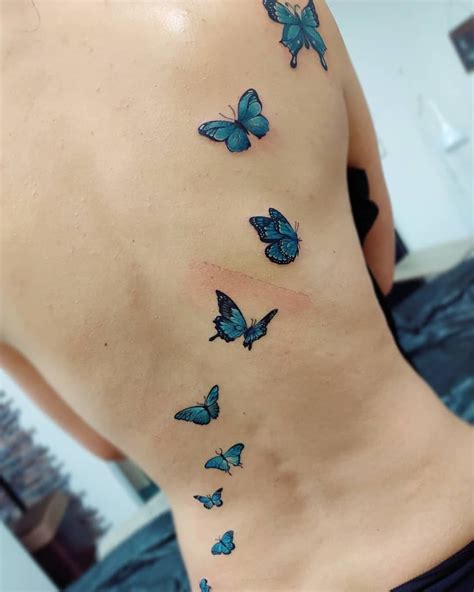 Blue Butterfly Tattoo Lower Back