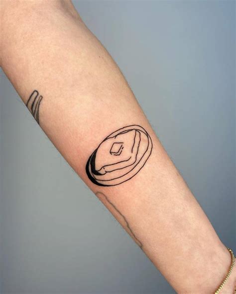 Hand poked toast tattoo located on the inner forearm.