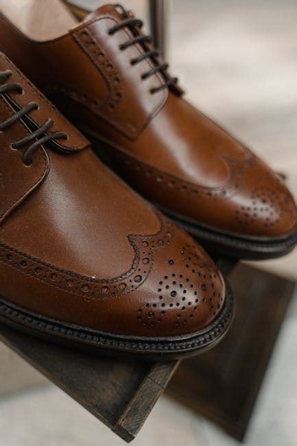 Brown Leather Shoes on Brown Wooden Table · Free Stock Photo