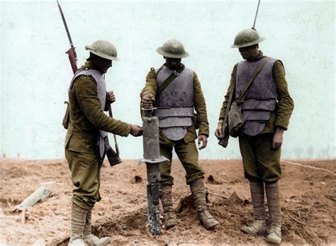 Three Irish soldiers in the British army wearing captured German body armour during WW1, at ...