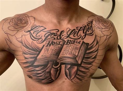 a man with an open bible tattoo on his chest