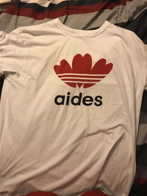 This knock-off Adidas shirt says aides Stupid Images, Funny Images ...