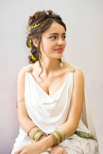 Portrait of a sitting young greek woman in antigue white dress — Stock ...