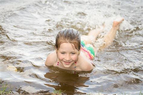 Pretty Nice Little Girl Swimming In Lake Stock Photo - Image: 47675886