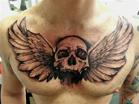 Share more than 82 skull with wings tattoo super hot - in.cdgdbentre