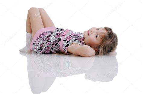 A beautiful little girl lying on the floor. Isolated on the whit — Stock Photo © Uralsky #4668655