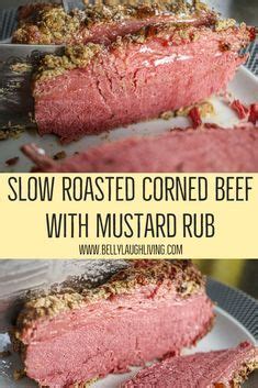 sliced corned beef with mustard rub on a white plate and the words slow roasted corned beef with ...