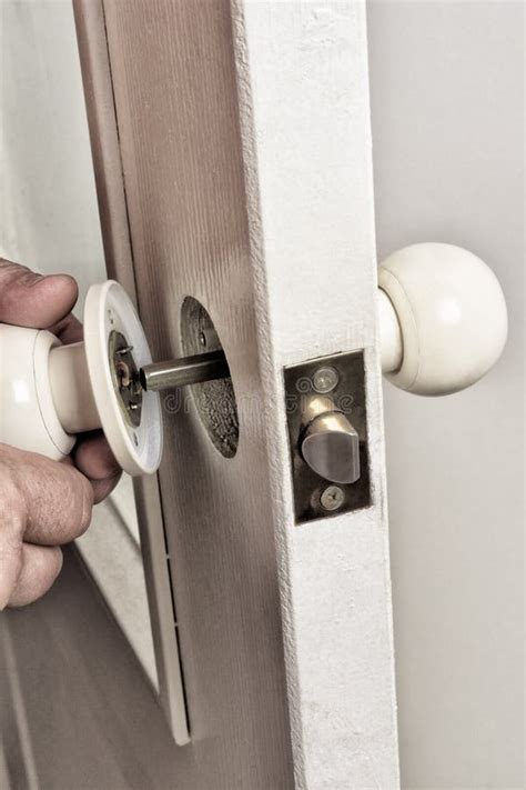 Install Latch with a Screwdriver on the Door. Stock Image - Image of ...