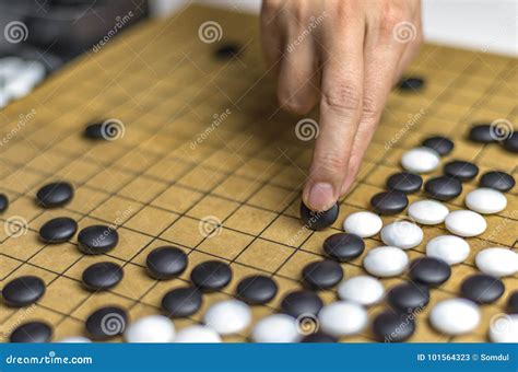 Playing Go or Igo, Chinese Board Game Stock Image - Image of wood, close: 101564323