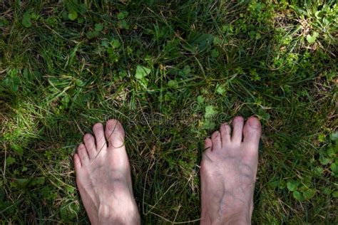 Male Adult Funny Feet on Green Grass Stock Photo - Image of outdoors, garden: 137149952