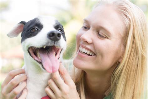 Happy Dog Owner Petting and Talking To Her Dog. Animal Communication ...