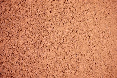 Premium Photo | Red sand texture of tennis field