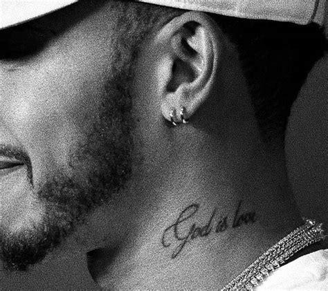 “God is love” tattoo on Lewis Hamilton's left side