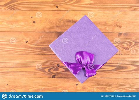 Gift box on wood table stock photo. Image of text, paper - 215937120
