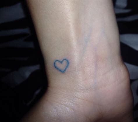 Blue heart wrist tattoo. My boyfriends favorite color. | Heart tattoo ...