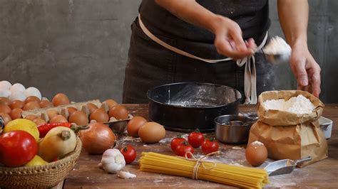 A Person Measuring Flour into the Baking Pan · Free Stock Video