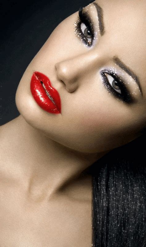 a woman with black hair and red lipstick
