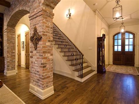 an entry way with stairs and wood flooring in a large house or home area