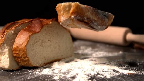 Loaf Of Bread Falling On Black Background In Slow Motion Stock Footage ...