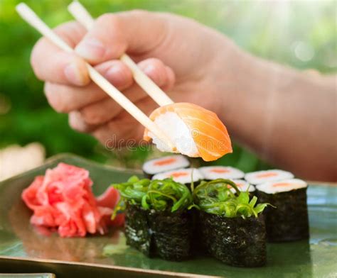 Sushi with chopsticks stock image. Image of oriental - 69894405