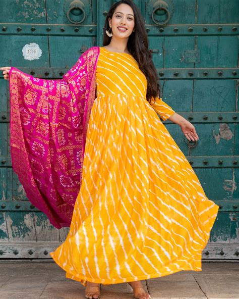 Yellow leheriya upada silk dress with pink banarsi silk dupatta - set ...