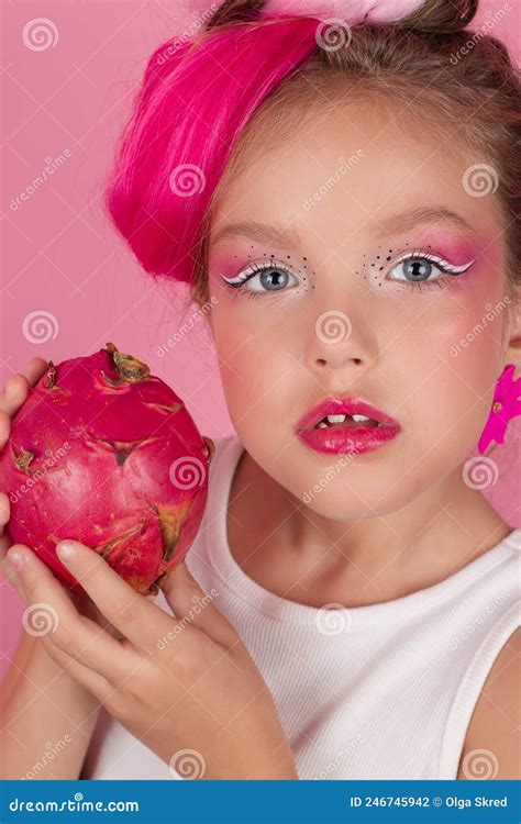 Sweet Girl is Holding a Pitahaya Near Her Face. a Pitaya Fruit Hold in ...