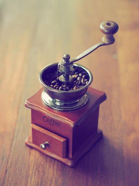 Premium Photo | Close-up of coffee with grinder on table