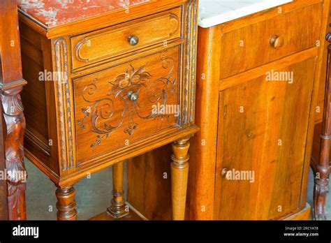 Antique italian wooden bedside table just restored with floral decorations Stock Photo - Alamy