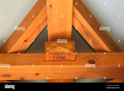 Mortise joint in timber frame beams on ceiling of main bathroom inside timber frame home Stock ...