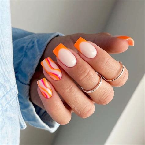 Check out these hot orange french tip nails with pink and orange swirls ...