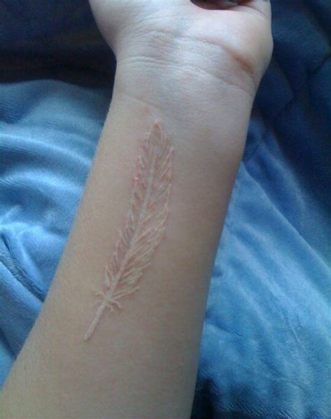 White feather tattoo ️ Beautiful tattoo inspiration White Ink Tattoos Healed, White Feather ...