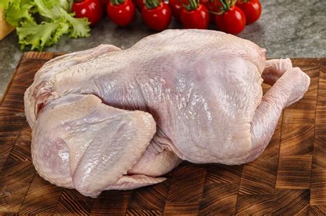 Premium Photo | Raw whole chicken for cooking