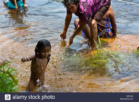 Local People taking a Bath in the River at the Teuk Chhou Rapids in Stock Photo: 57704338 - Alamy