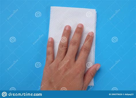 Woman`s Hand Wiping Blue Desk with White Tissue Stock Photo - Image of ...
